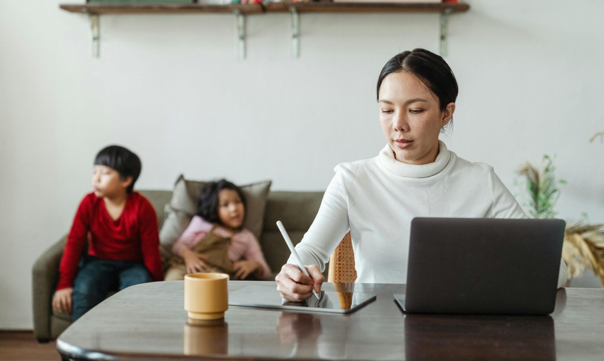 Photo by Ketut Subiyanto: https://www.pexels.com/photo/mum-working-on-laptop-at-table-with-bored-children-behind-4474041/